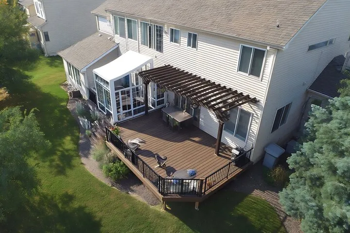 Waukesha contractors building a stable floating deck foundation using adjustable pedestals and concrete pads without house attachment.
