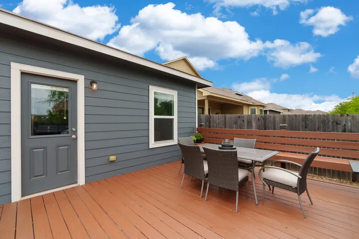 Professional patio construction process showing proper base preparation, drainage, and paver installation