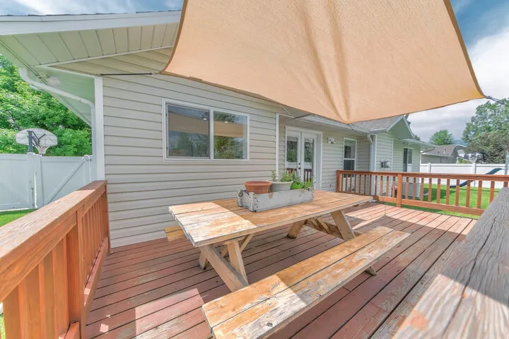 Custom covered patio and pergola installation by Waukesha builders for shaded, year-round outdoor entertainment.