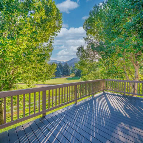 Custom patio design featuring built-in seating, retaining walls, and integrated lighting for unique landscape challenges