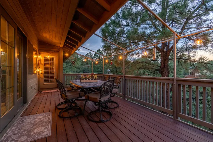 Custom ground-level hardscape and stone patio installation for outdoor dining areas.